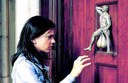 Girl contemplating knocking on a door, for which the knocker is the testicles of a little man's statue